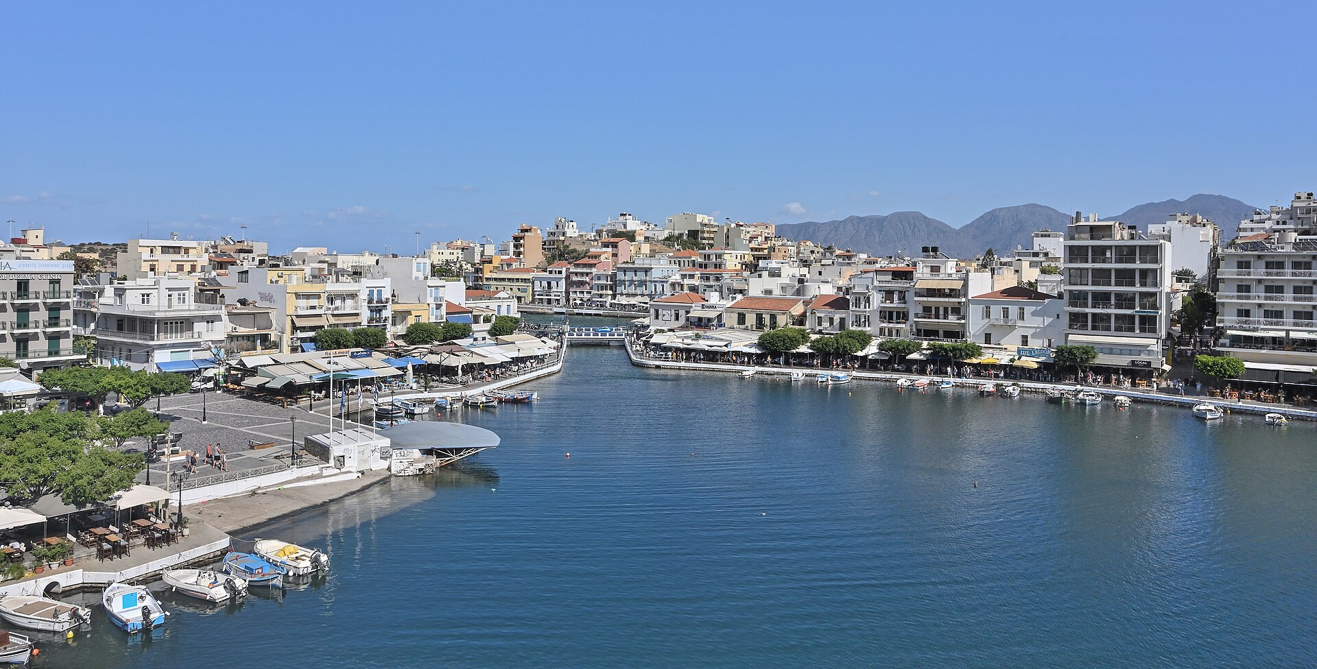 Lake Voulismeni in the centre of Agios Nikolaos, eastern Crete, ringed by waterfront buildings on Mirabello Bay