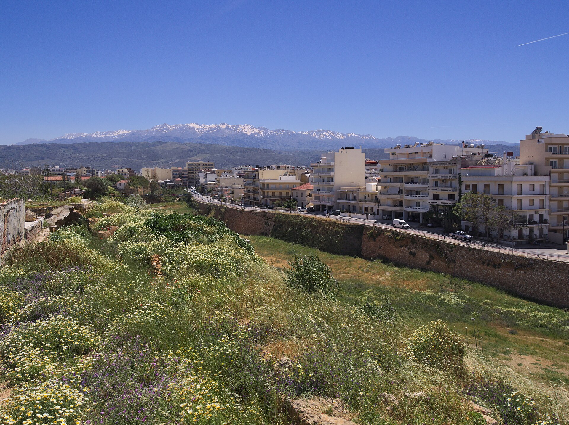 View over the town of Chania with the Lefka Ori (White Mountains) rising behind it, Crete