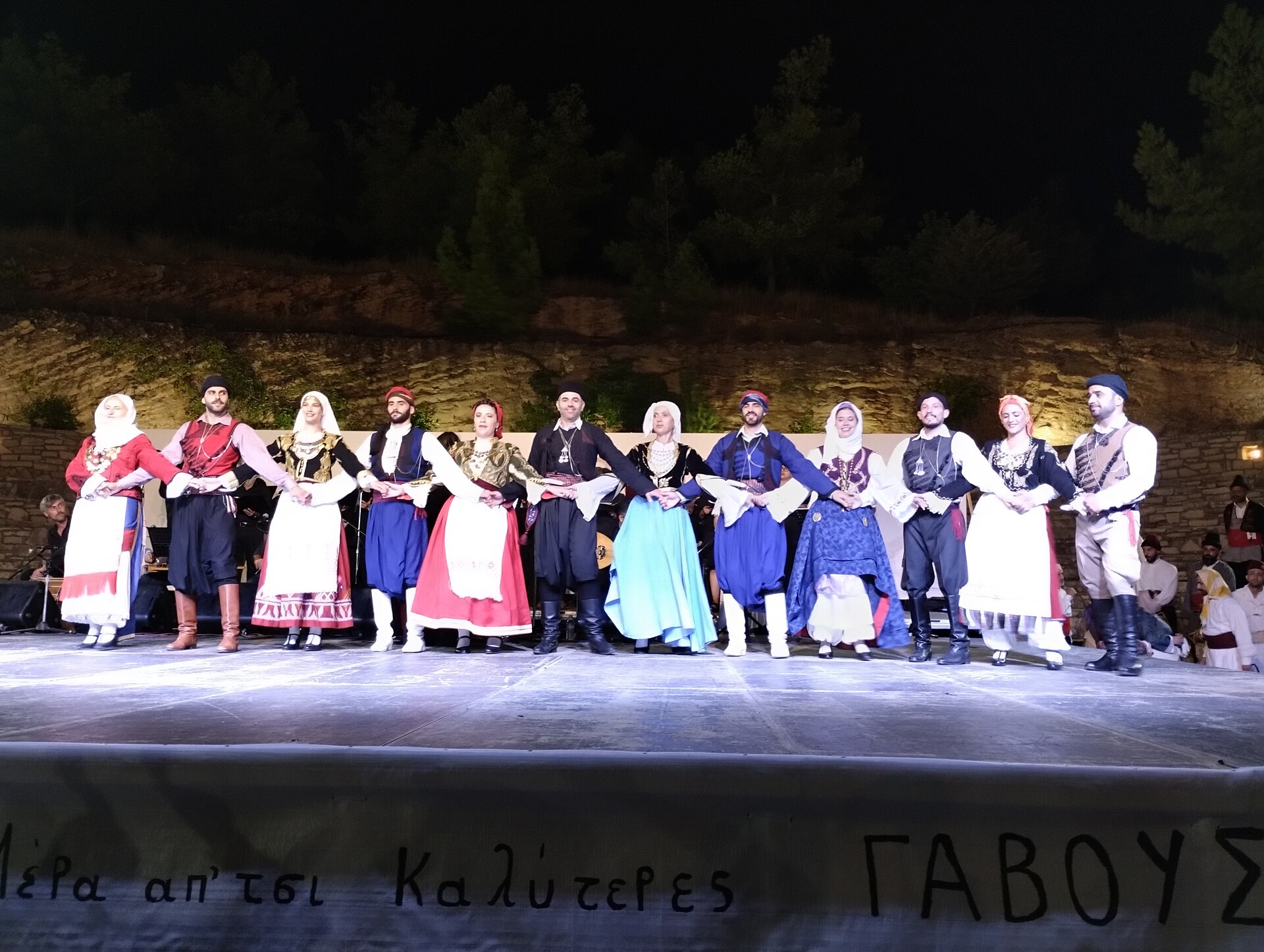 Dancers in traditional Cretan dress performing a line dance at the Gavoustima folk festival in central Crete