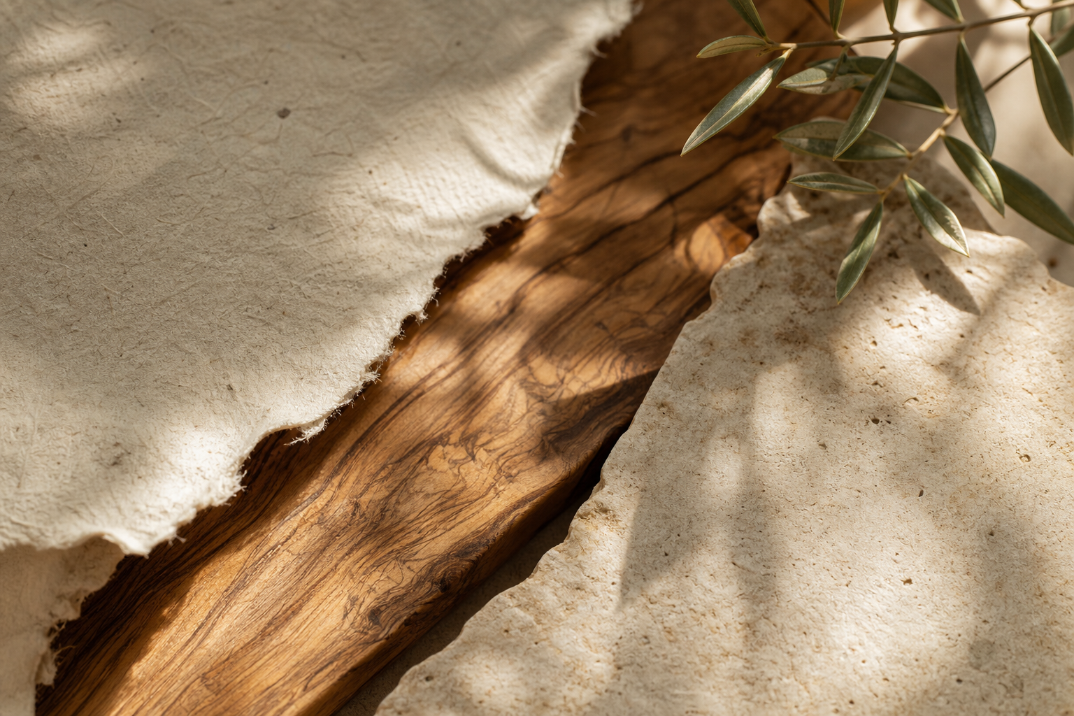 Warm stone, olive wood, and handmade paper in Cretan morning light