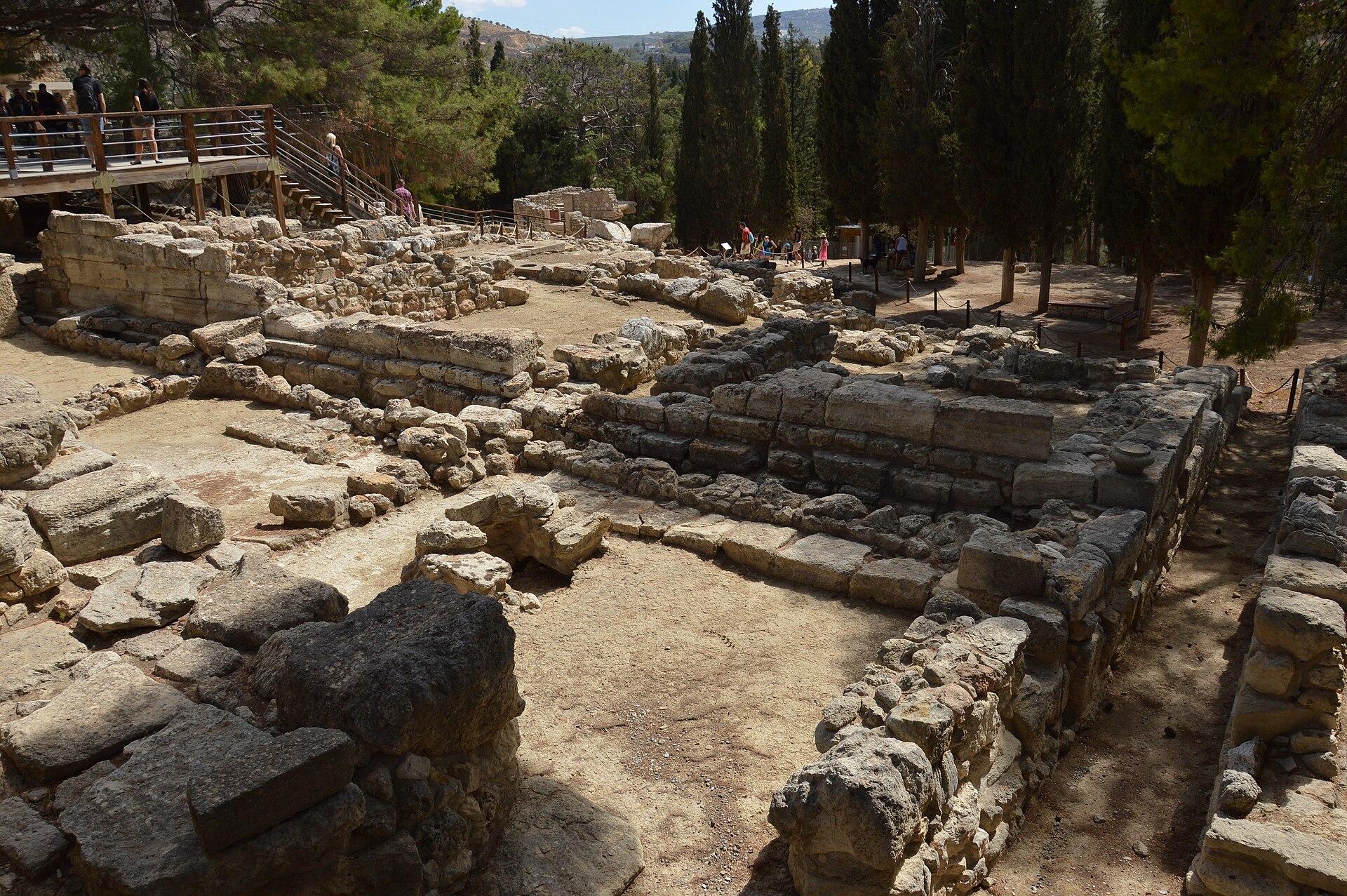 Part of the excavated ruins of the Minoan palace at Knossos, Crete: reconstructed stone walls, doorways, and steps