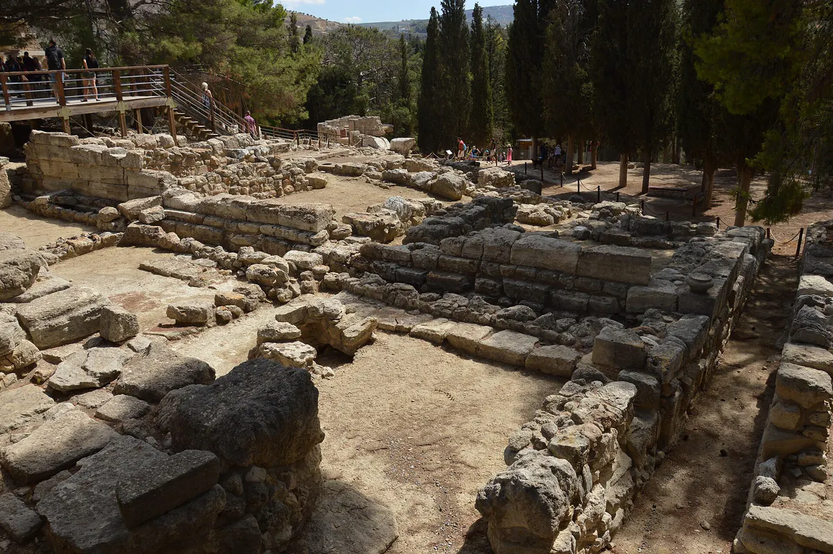 Part of the excavated ruins of the Minoan palace at Knossos, Crete: reconstructed stone walls, doorways, and steps