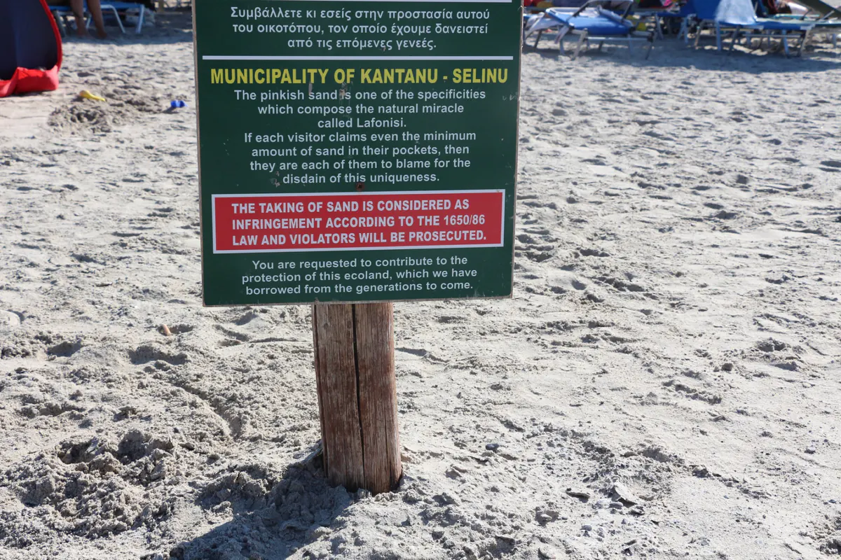 Sign at Elafonissi Beach reminding visitors to leave protected sand in place