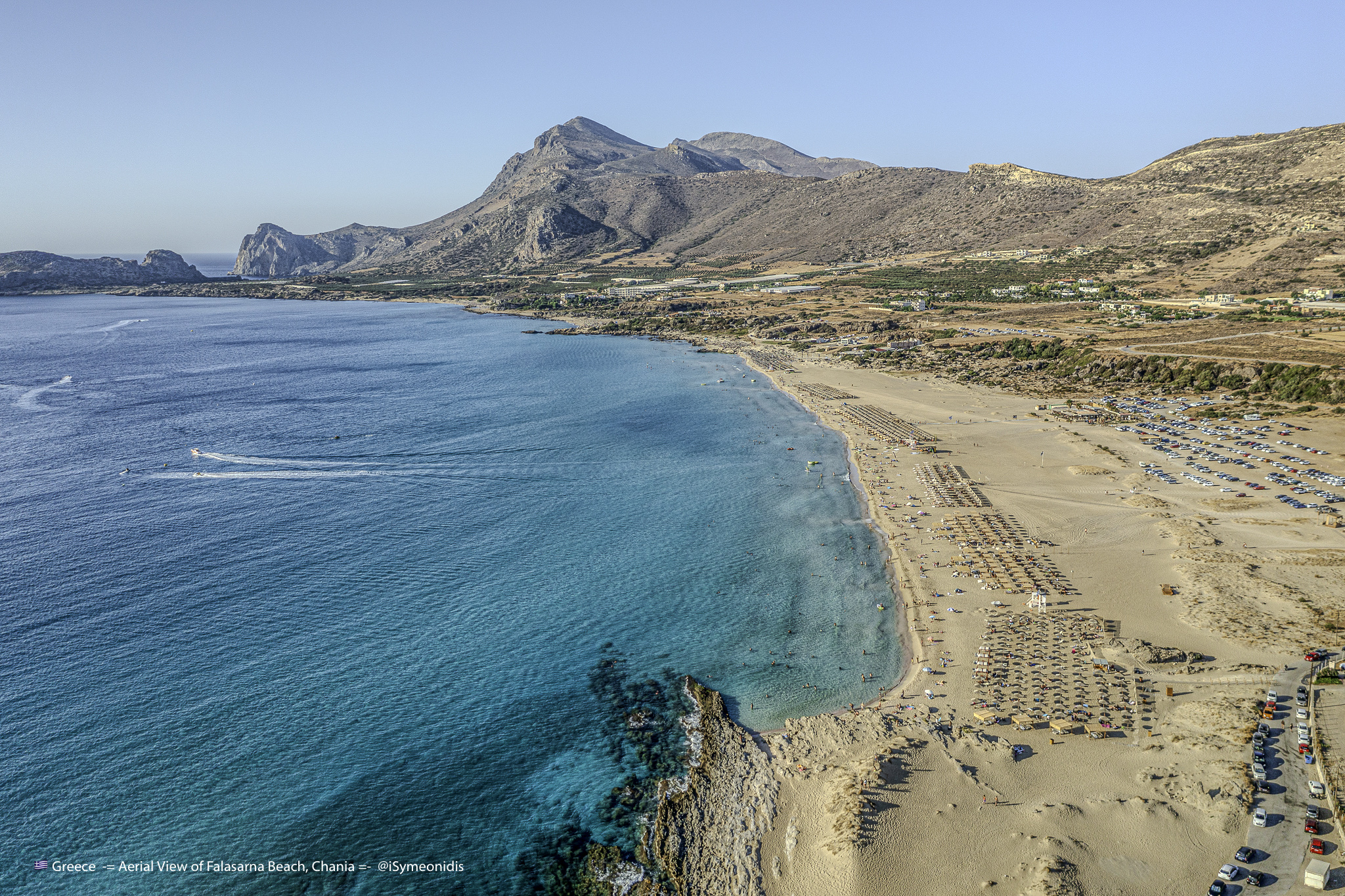 Aerial view of Falasarna Beach, broad sand, clear water, and the west coast of Chania, Crete
