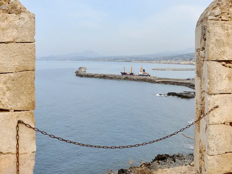 Rethymno's harbor seen through an opening in the walls of the Fortezza.