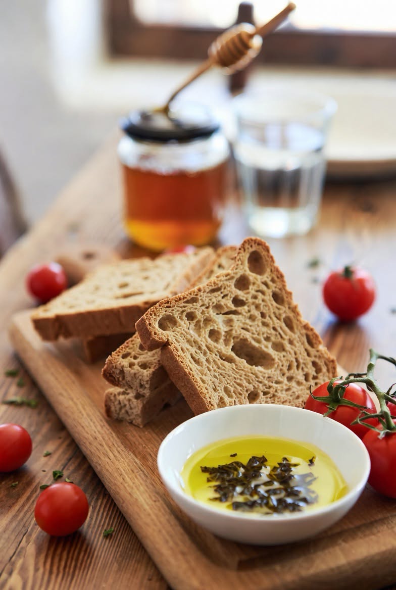 Traditional Cretan barley rusks on a wooden surface