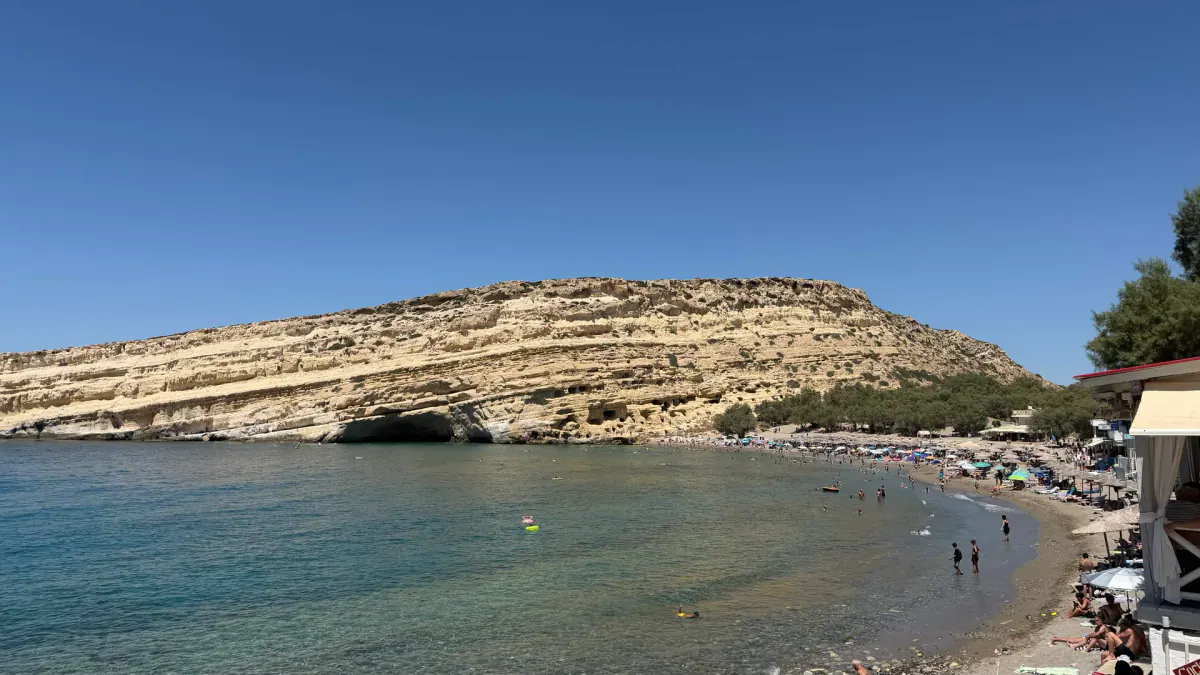 Matala bay and the cave-cut sandstone cliff above the beach