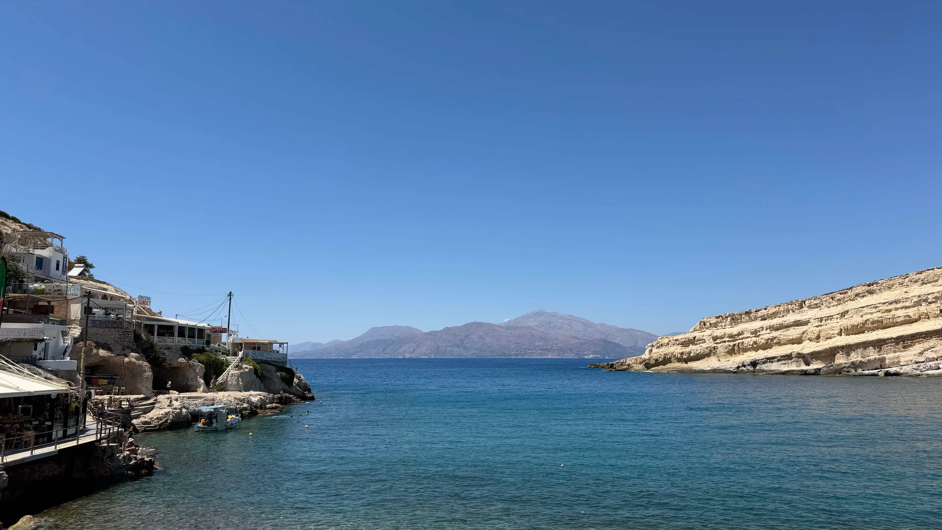 The western edge of Matala bay with the Libyan Sea and mountains beyond